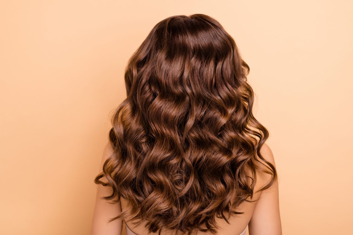 Back rear side photo of charming girl show perfect strong wellness hairstyle hairdo after hairdresser therapy coiffure have professional hair coloration isolated over pastel color background